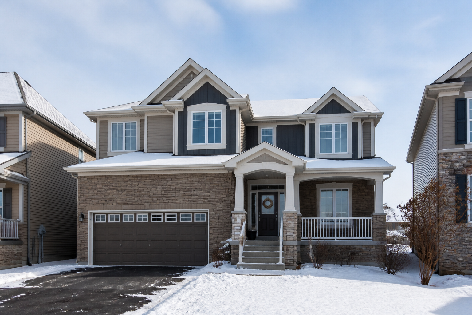 Exterior of a detached Ontario home in winter showing clean new vinyl windows and updated curb appeal
